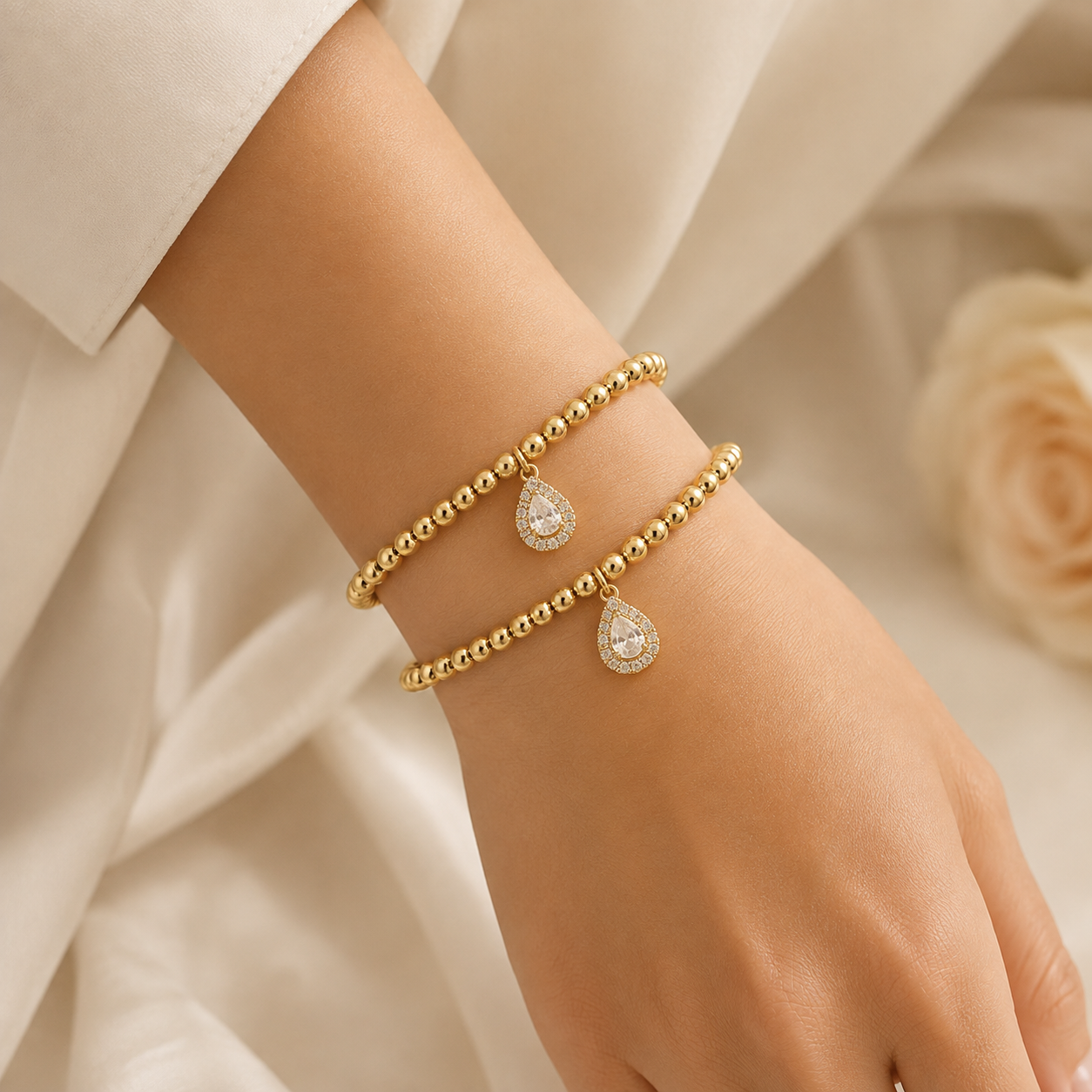 Gold Beaded Stretch Bracelet with CZ Teardrop Charm