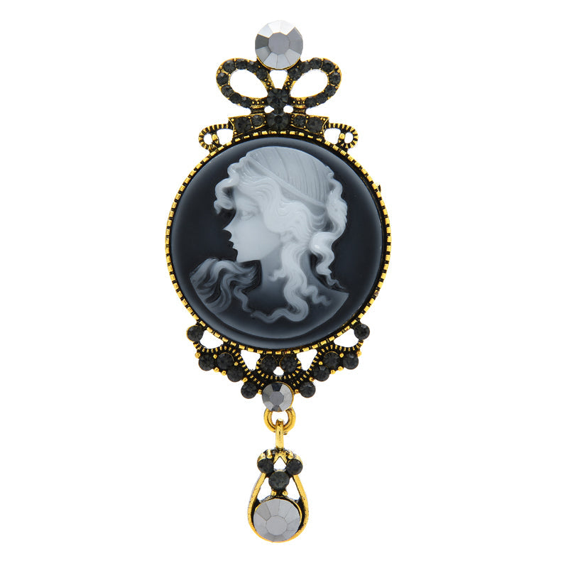 Vintage cameo bow drop brooch with dimension guide, 8.6 cm tall by 3.7 cm wide
