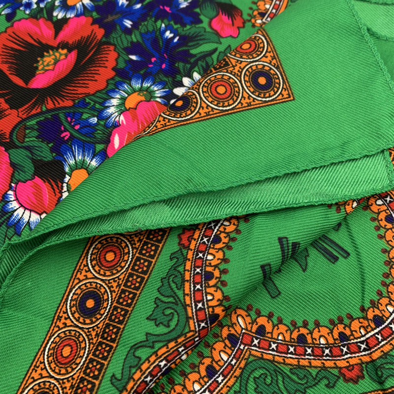 Green floral square scarf laid flat showing full print and ornamental border