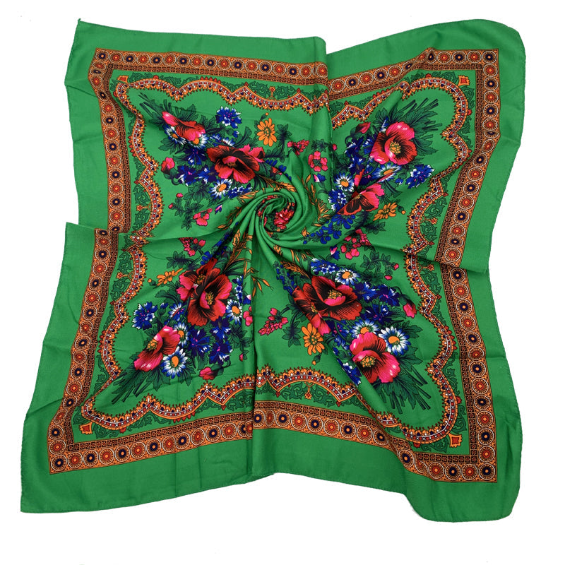 Green floral square scarf draped showing four-corner floral arrangement