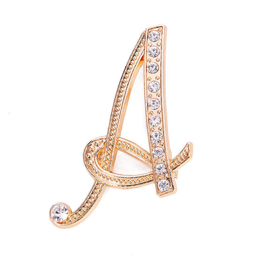 Gold crystal initial A letter brooch pin showing multiple script letter styles including A, S, and M