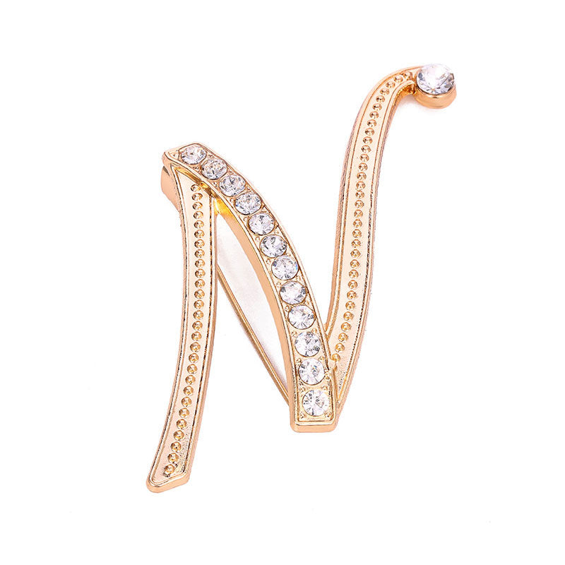 Gold Crystal Initial N Letter Brooch Pin in bold script with clear rhinestone crystals and large crystal accent on gold-tone metal