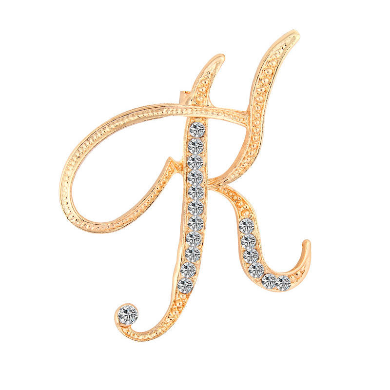 Gold Crystal Initial K Letter Brooch Pin in flowing cursive script with clear rhinestone crystals and single crystal accent on gold-tone metal