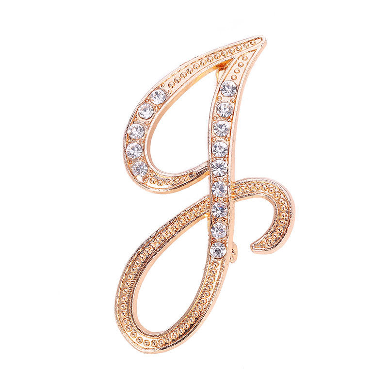 Gold Crystal Initial J Letter Brooch Pin in large flowing cursive script with clear rhinestone crystals on gold-tone metal