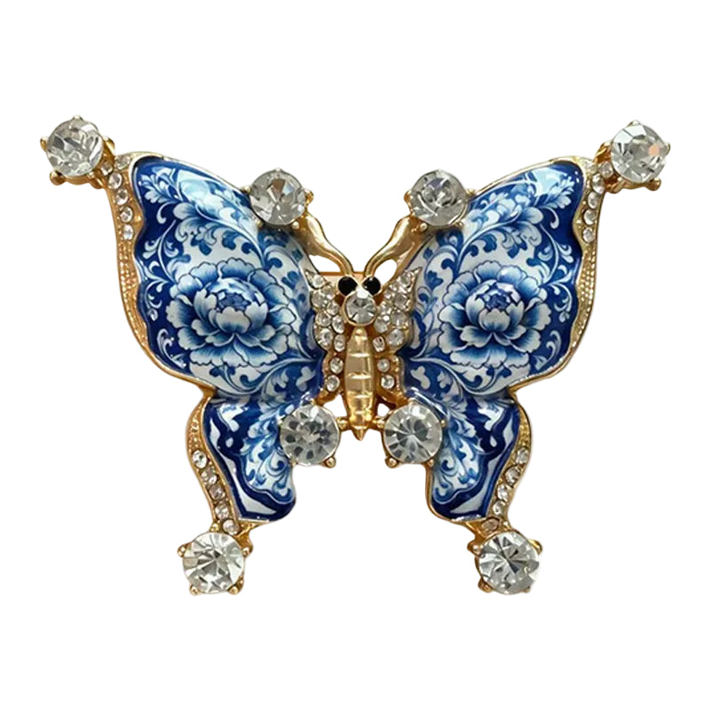 Blue porcelain enamel parrot brooch perched on flower branch with crystal crest accent