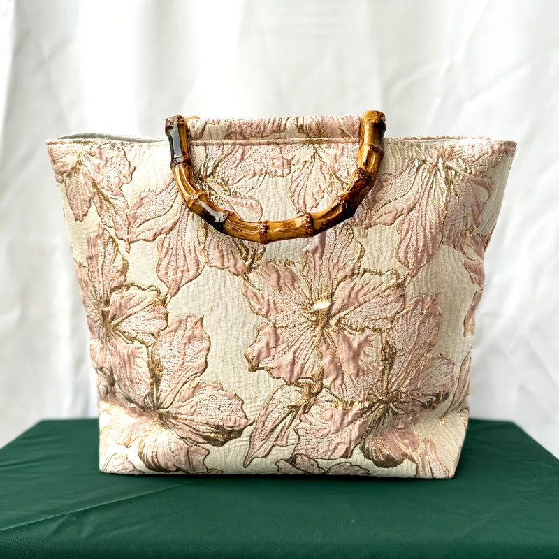 Blush floral jacquard tote bag with bamboo handles - front angle