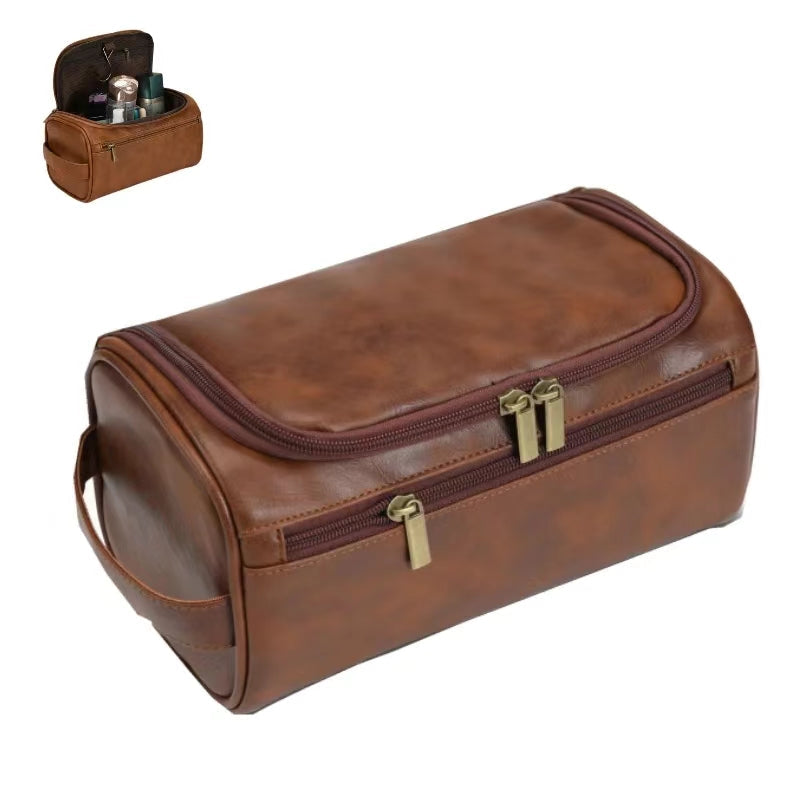 Brown vegan leather travel toiletry bag held in hand, front view