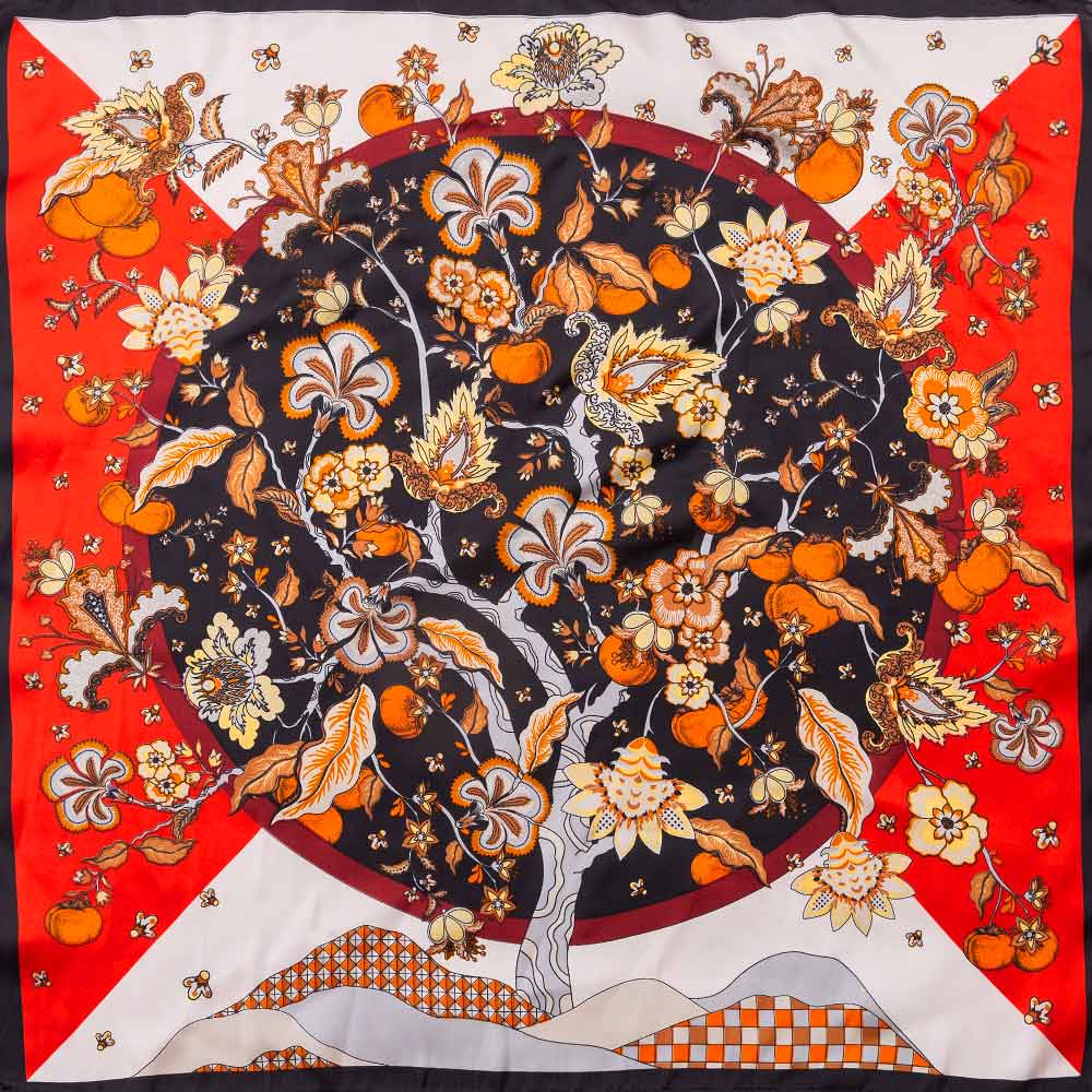 Women's square floral scarf in black red and orange botanical print styled with handbag