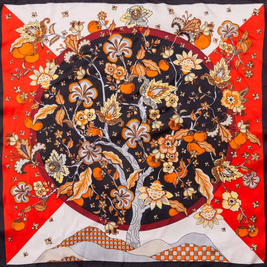 Women's square floral scarf in black red and orange botanical print styled with handbag