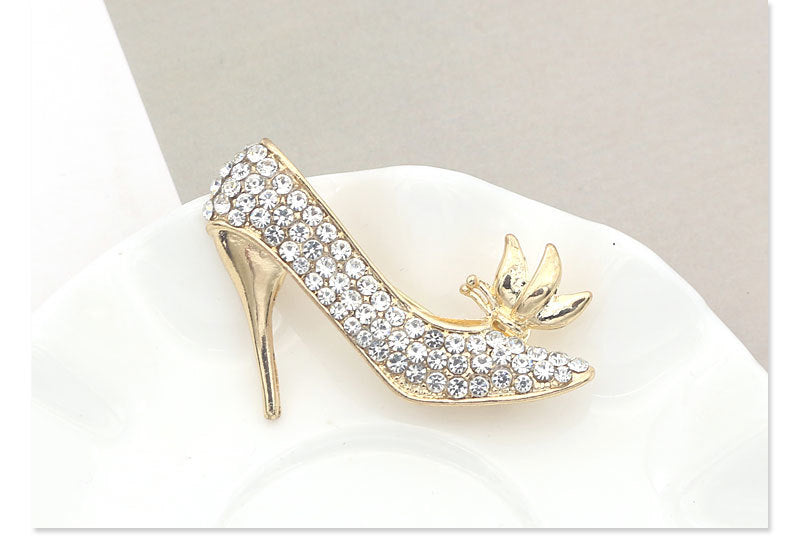 Crystal rhinestone Eiffel Tower brooch – angled view on dark stone