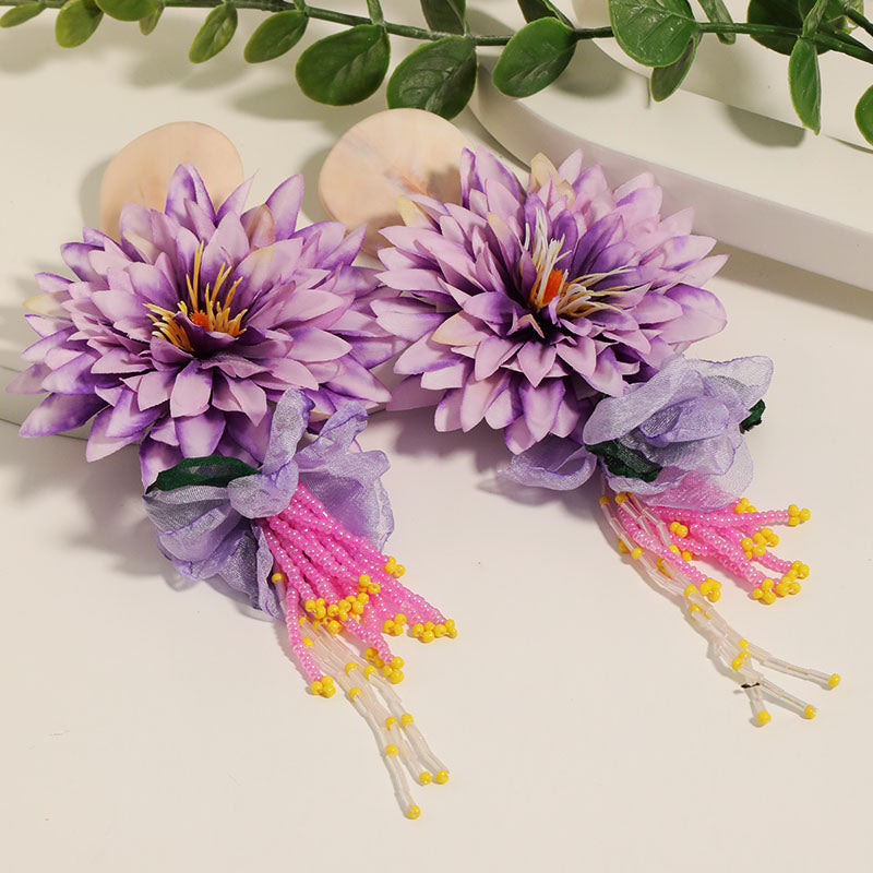 Dahlia flower beaded tassel drop earrings in lavender purple - flatlay view