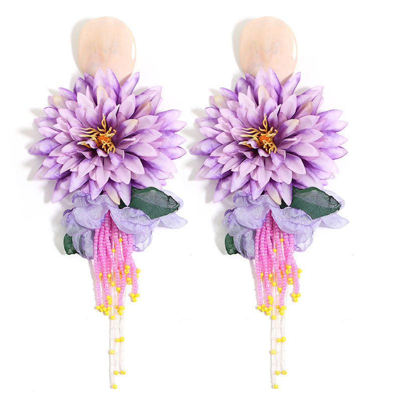 Dahlia flower beaded tassel drop earrings in blue - flatlay view