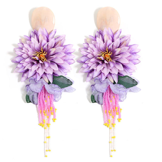 Dahlia flower beaded tassel drop earrings in blue - flatlay view