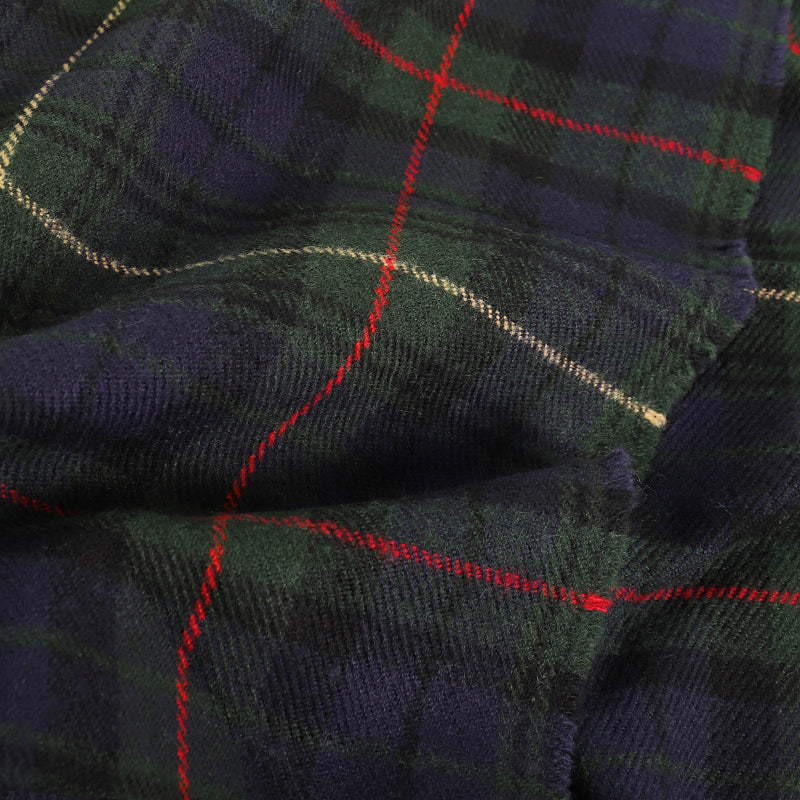 Close-up of navy forest green tartan plaid weave with red and gold accent stripes