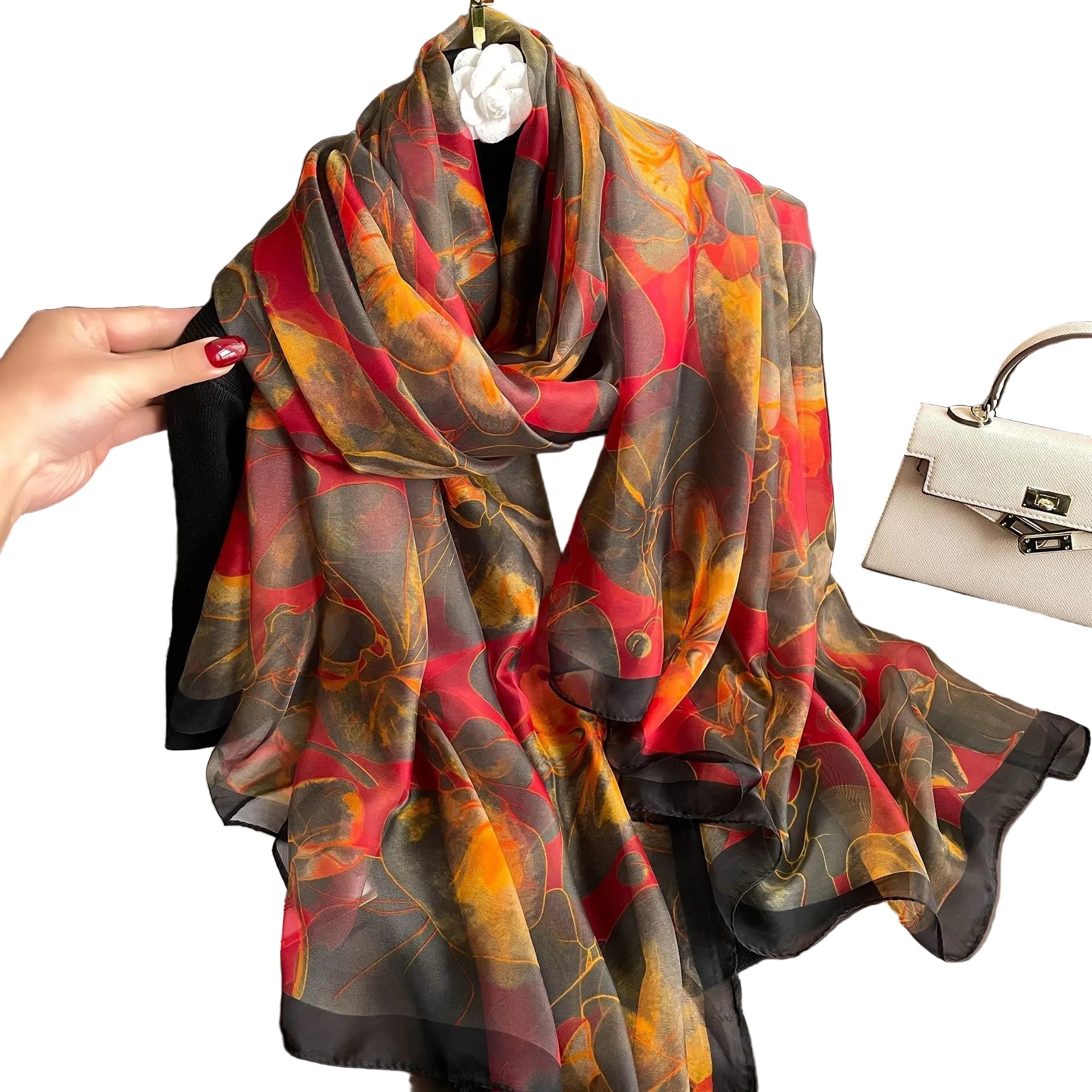 Autumn ember floral silk-feel wrap scarf in crimson, gold, and charcoal — draped and knotted view