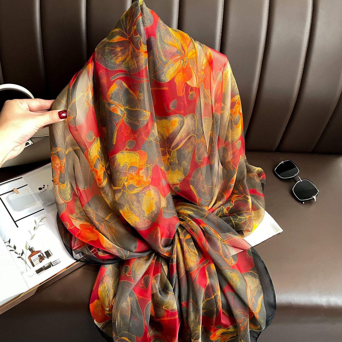 Oversized floral silk-feel scarf in autumn tones — loose wrap styling view