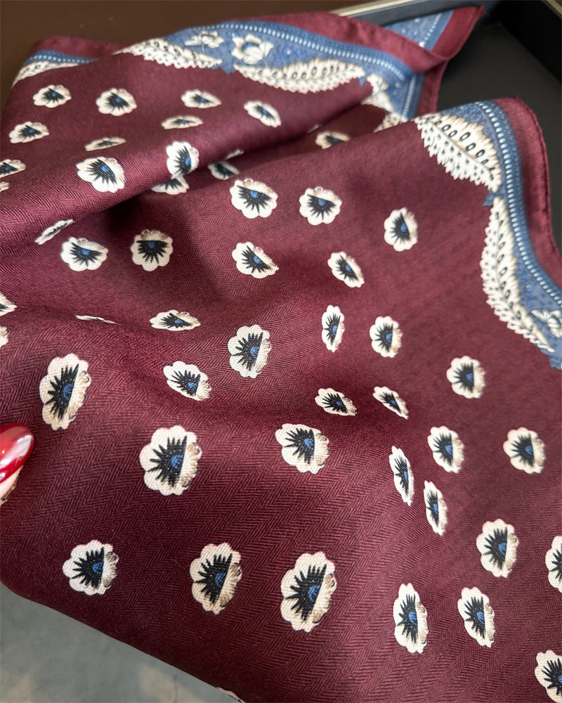 Burgundy cotton-blend scarf held open showing full square dimensions and all-over floral print
