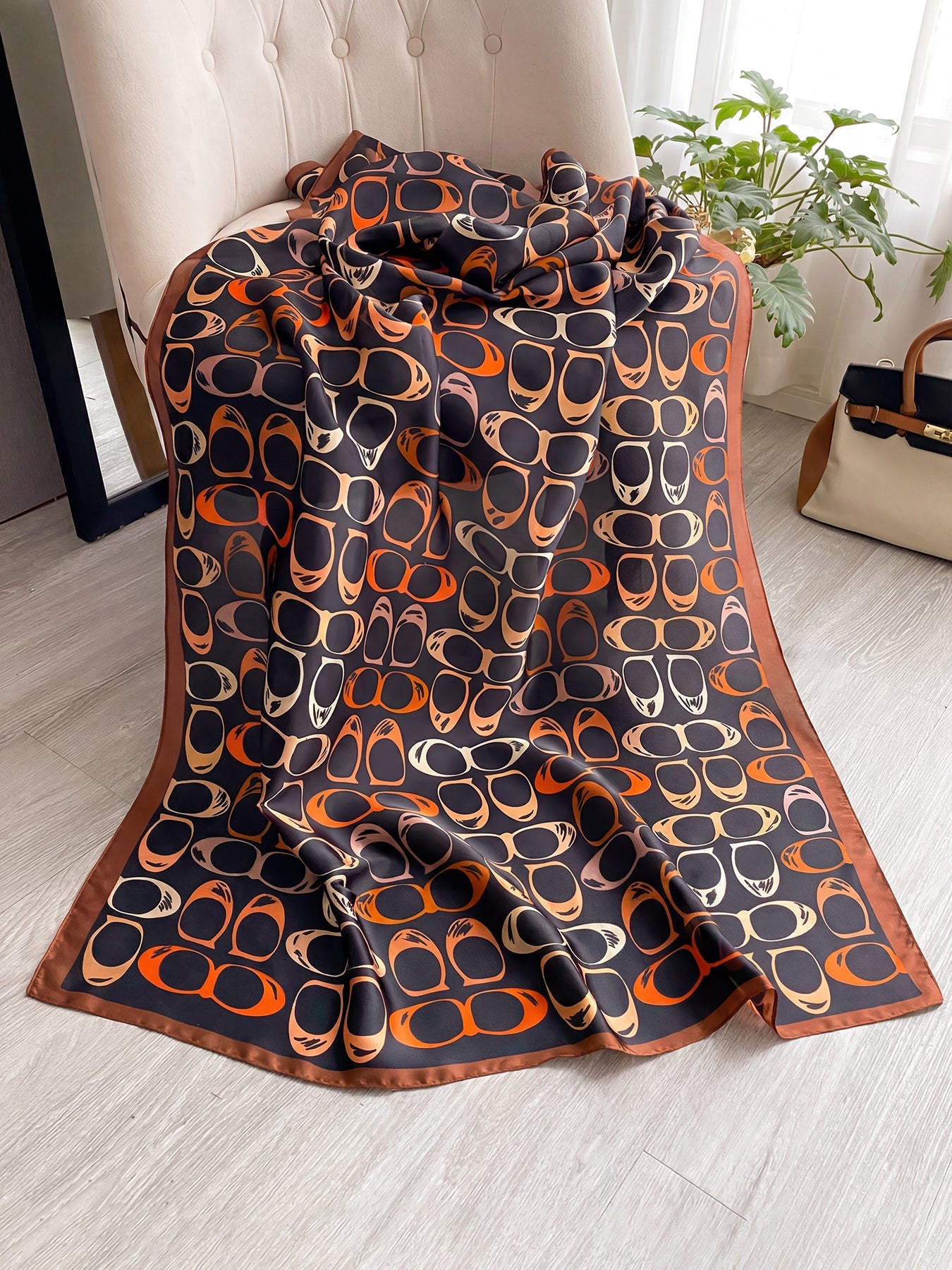 Full flat lay of retro sunglasses print silk-feel scarf showing allover pattern detail