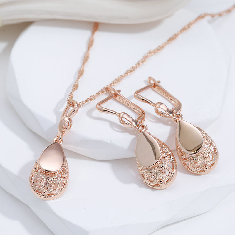 Rose gold filigree teardrop pendant necklace on display