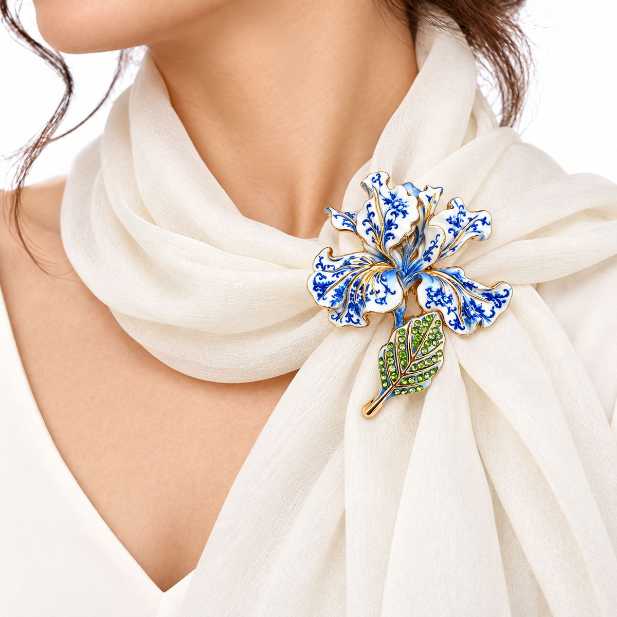 Blue white iris brooch pinned on white scarf