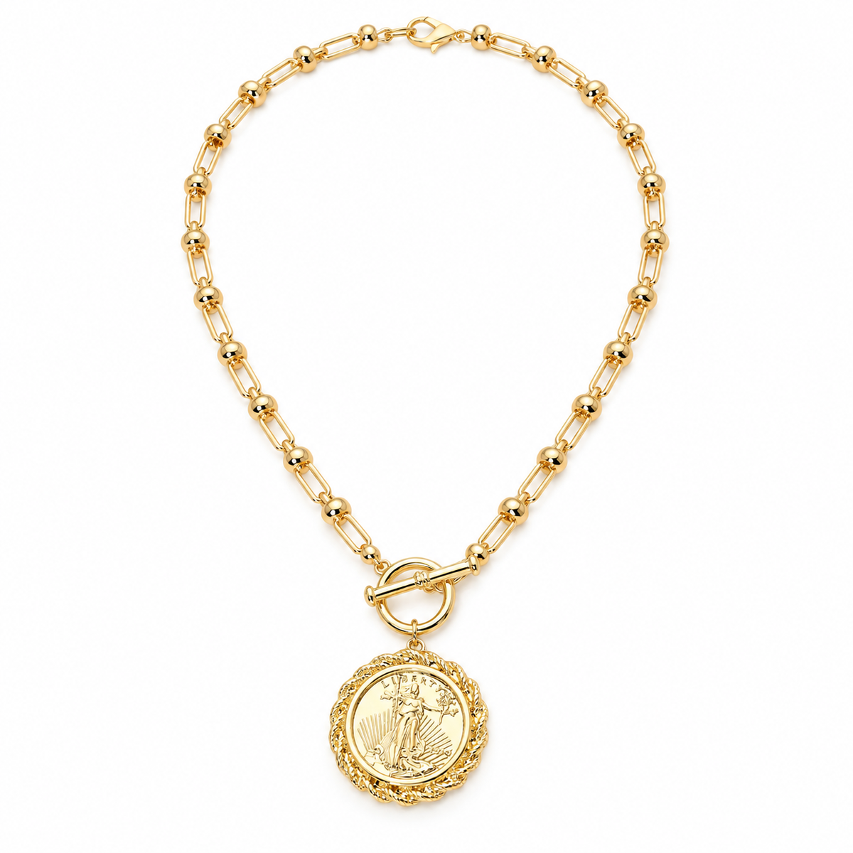 Gold Liberty coin pendant necklace with ornate rope-textured border on warm background
