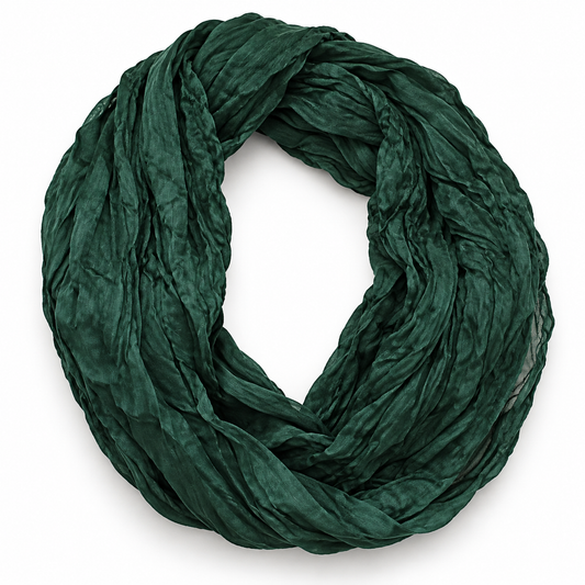 Deep forest green crinkle-texture infinity scarf coiled in a loop, white background product shot