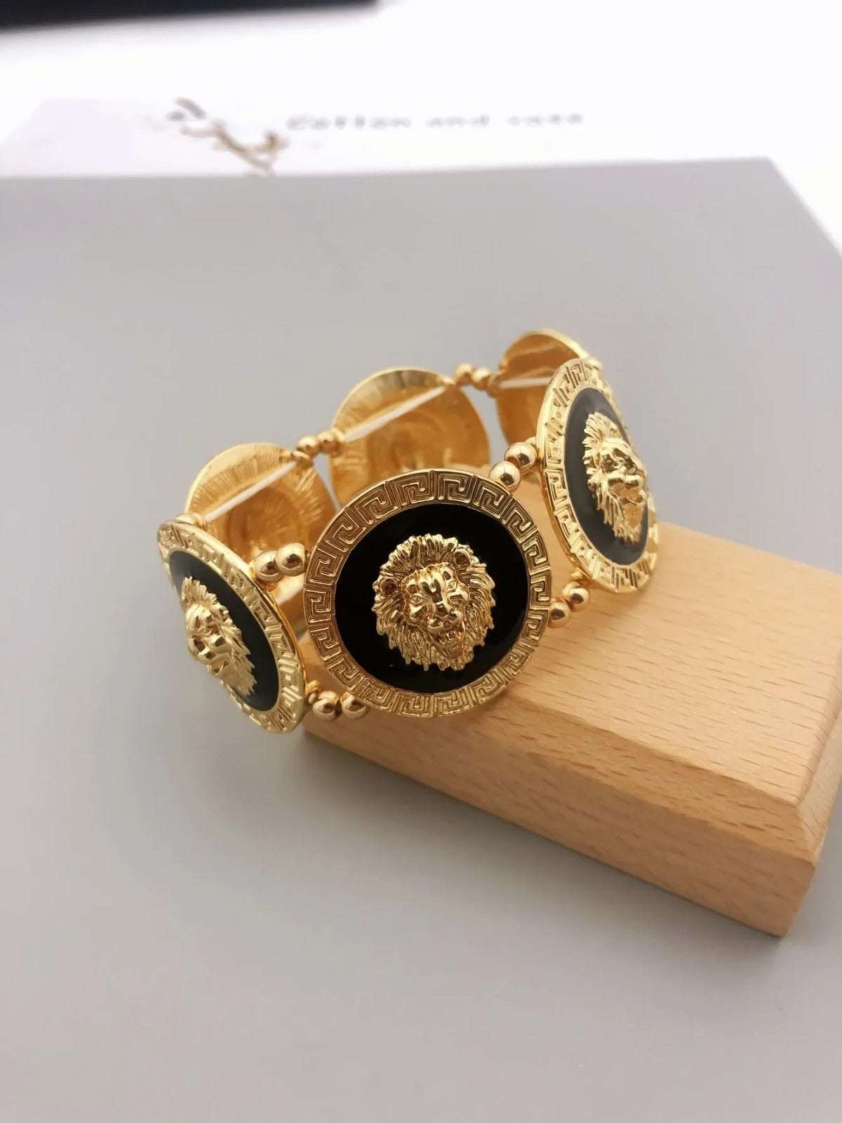 Gold Tone Lion Head Bracelet Black Enamel Greek Key Stretch Medallion 6.7in