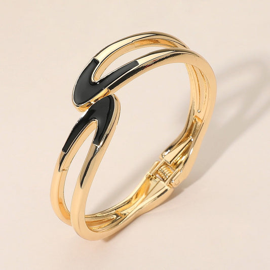Gold Interlocking Abstract Hinged Bangle Bracelet with Black Enamel Inlay