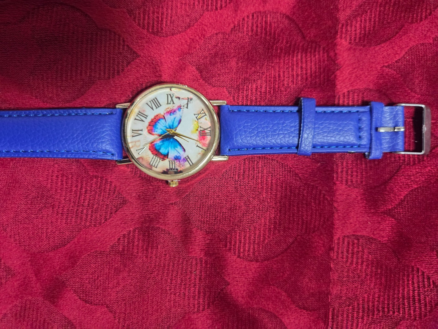 Women's Fashion Watch with Blue Strap & Butterfly Dial Roman Numerals