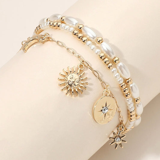 Gold Tone 3-Strand Pearl Beaded Bracelet Stretched with Sun Star Crescent Charm