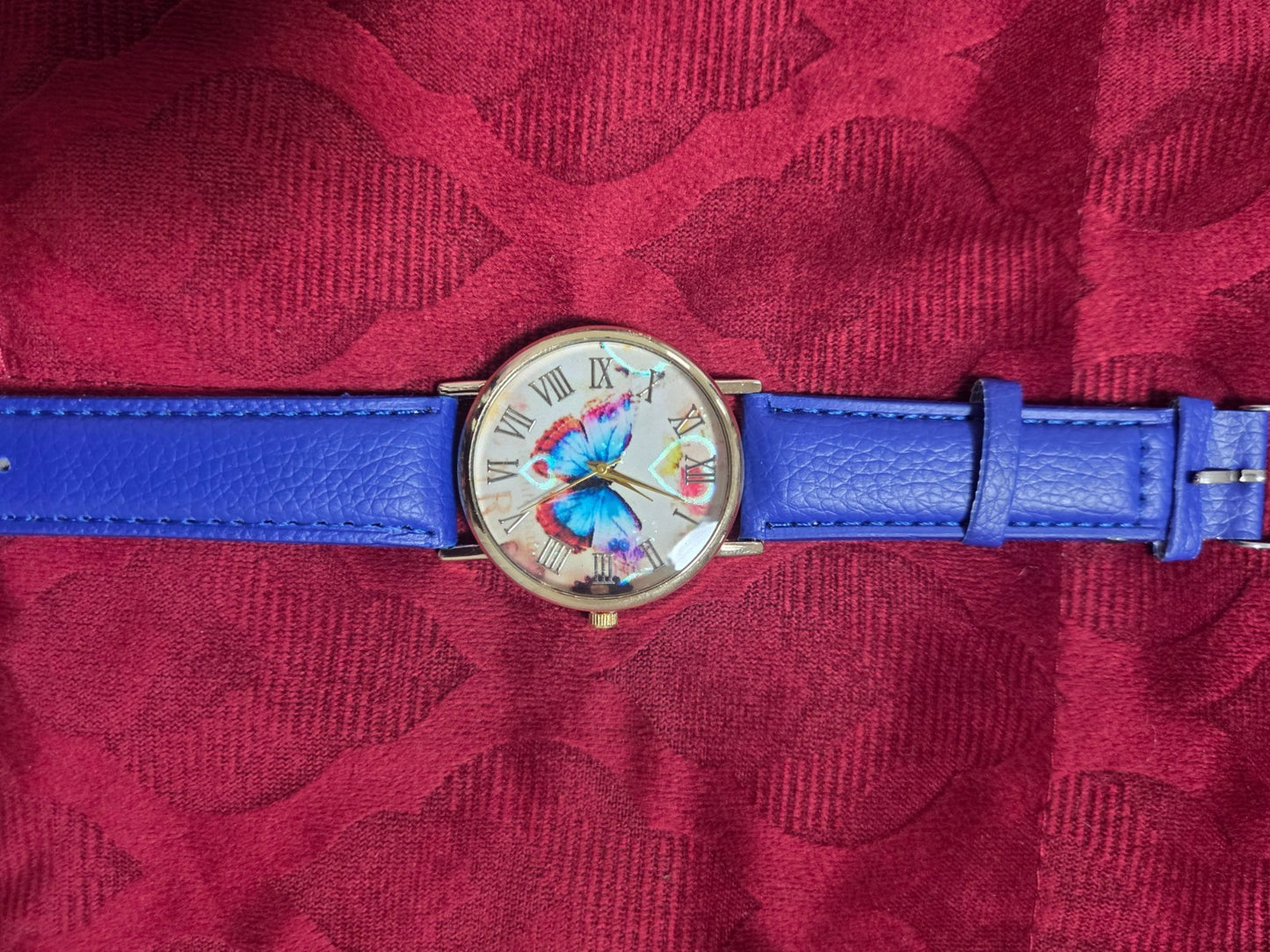 Women's Fashion Watch with Blue Strap & Butterfly Dial Roman Numerals