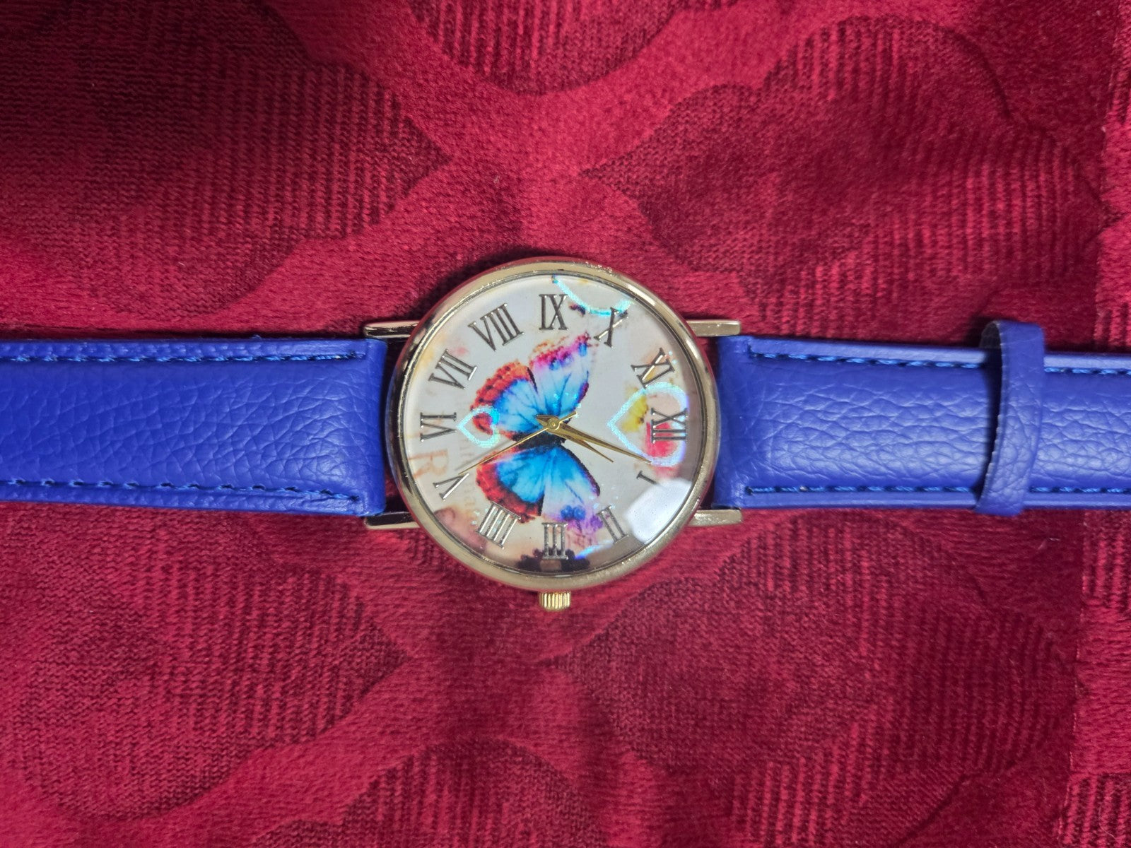 Women's Fashion Watch with Blue Strap & Butterfly Dial Roman Numerals
