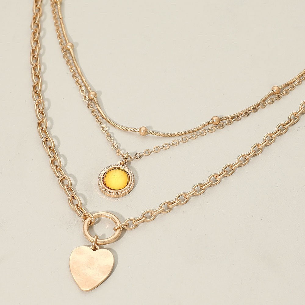 Gold Triple Layered Mixed Chain Amber Stone Heart Pendant Statement Necklace