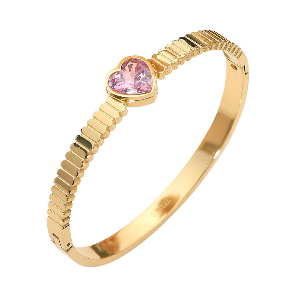 Gold Grooved Stainless Steel Bangle Bracelet with Pink Heart Crystal Center