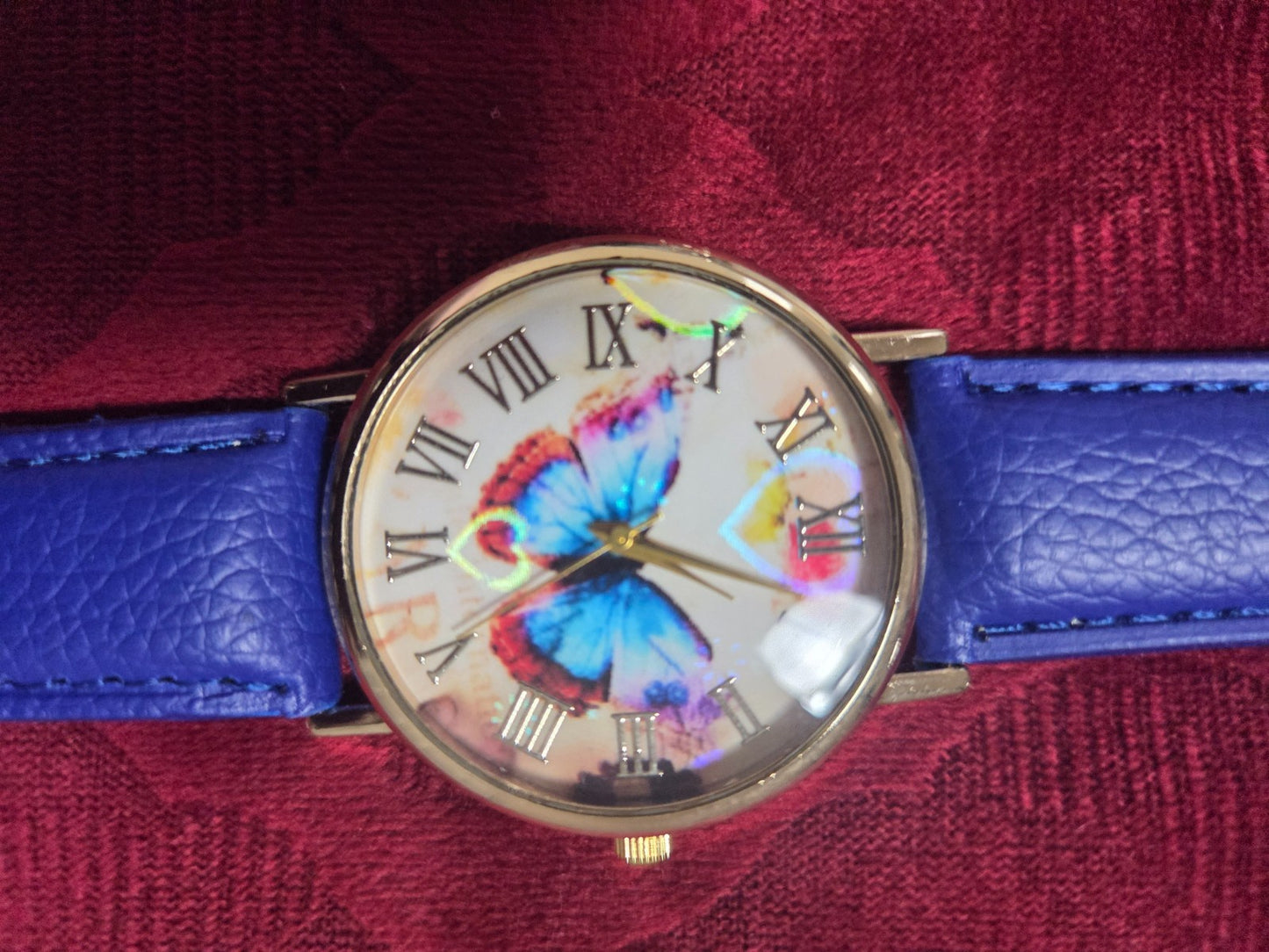 Women's Fashion Watch with Blue Strap & Butterfly Dial Roman Numerals