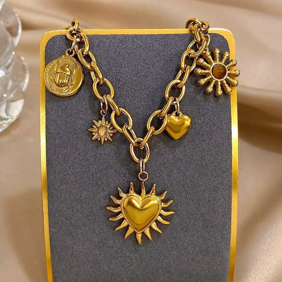 Gold Tone Celestial Charms Statement Necklace for Women Moon and Star Jewelry