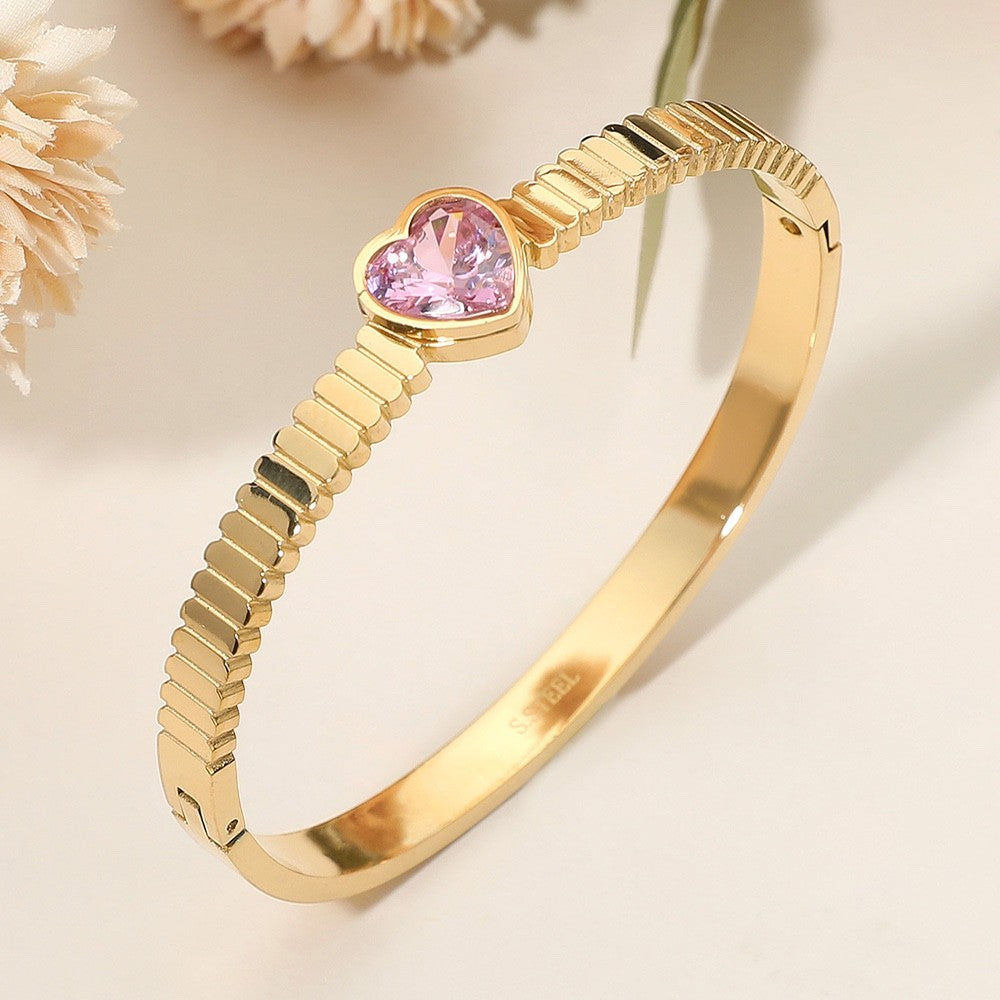 Gold Grooved Stainless Steel Bangle Bracelet with Pink Heart Crystal Center