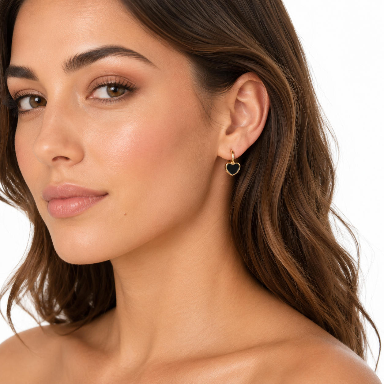 Model wearing mini gold hoop earrings from the 3-piece gold earring set