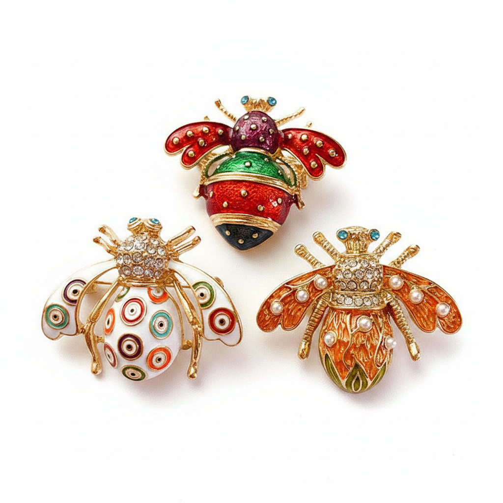 All 3 bee brooches circular arrangement - white background