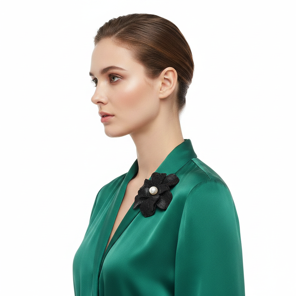 Brooch on emerald blouse
