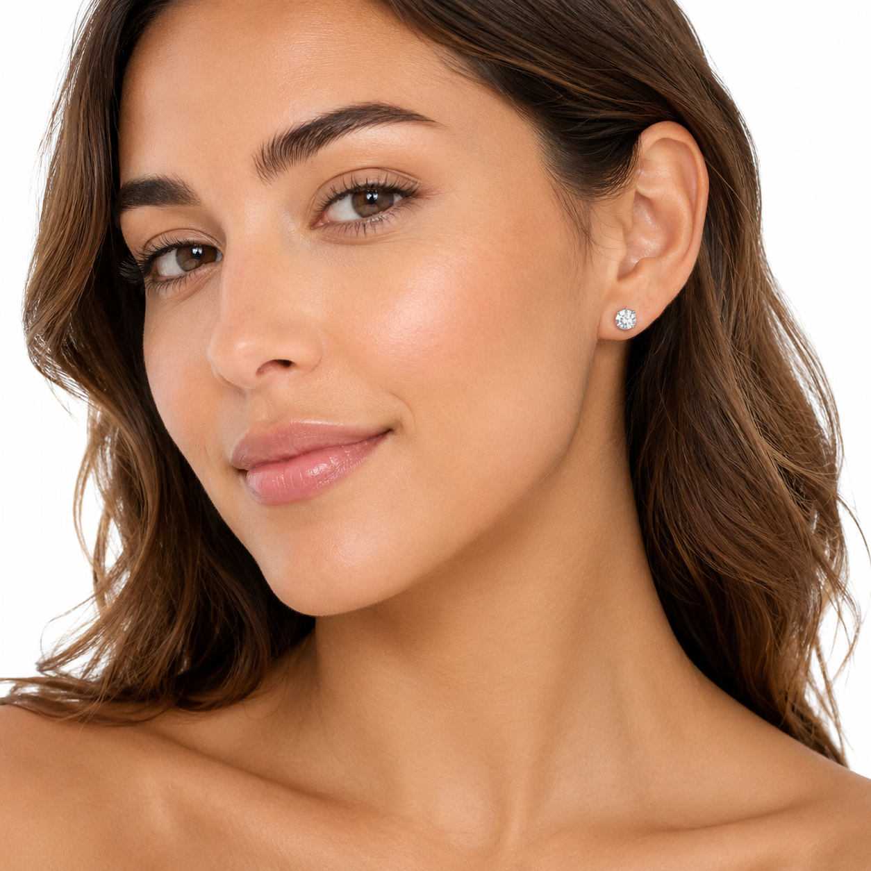 Model wearing black heart huggie earrings from the 3-piece gold earring set