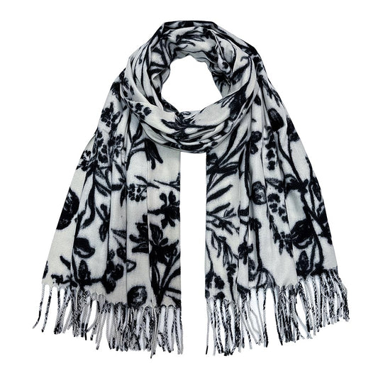 Black and white botanical floral print pashmina scarf shawl with twisted fringe tassels, flat lay