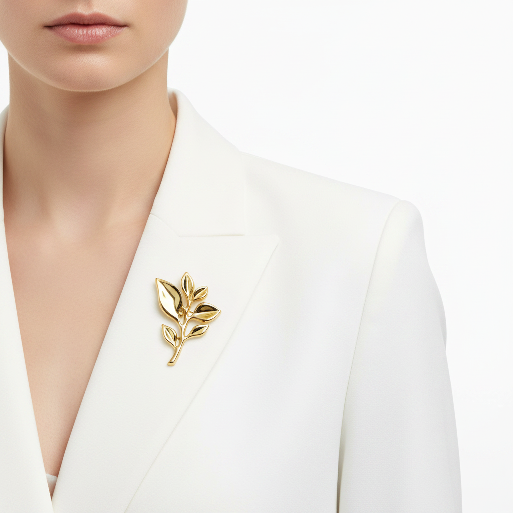 Gold leaf brooch on blazer lapel
