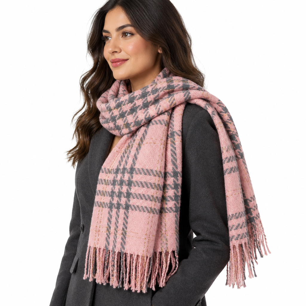 Side view of woman wearing pink and gray houndstooth fringed scarf over tailored jacket