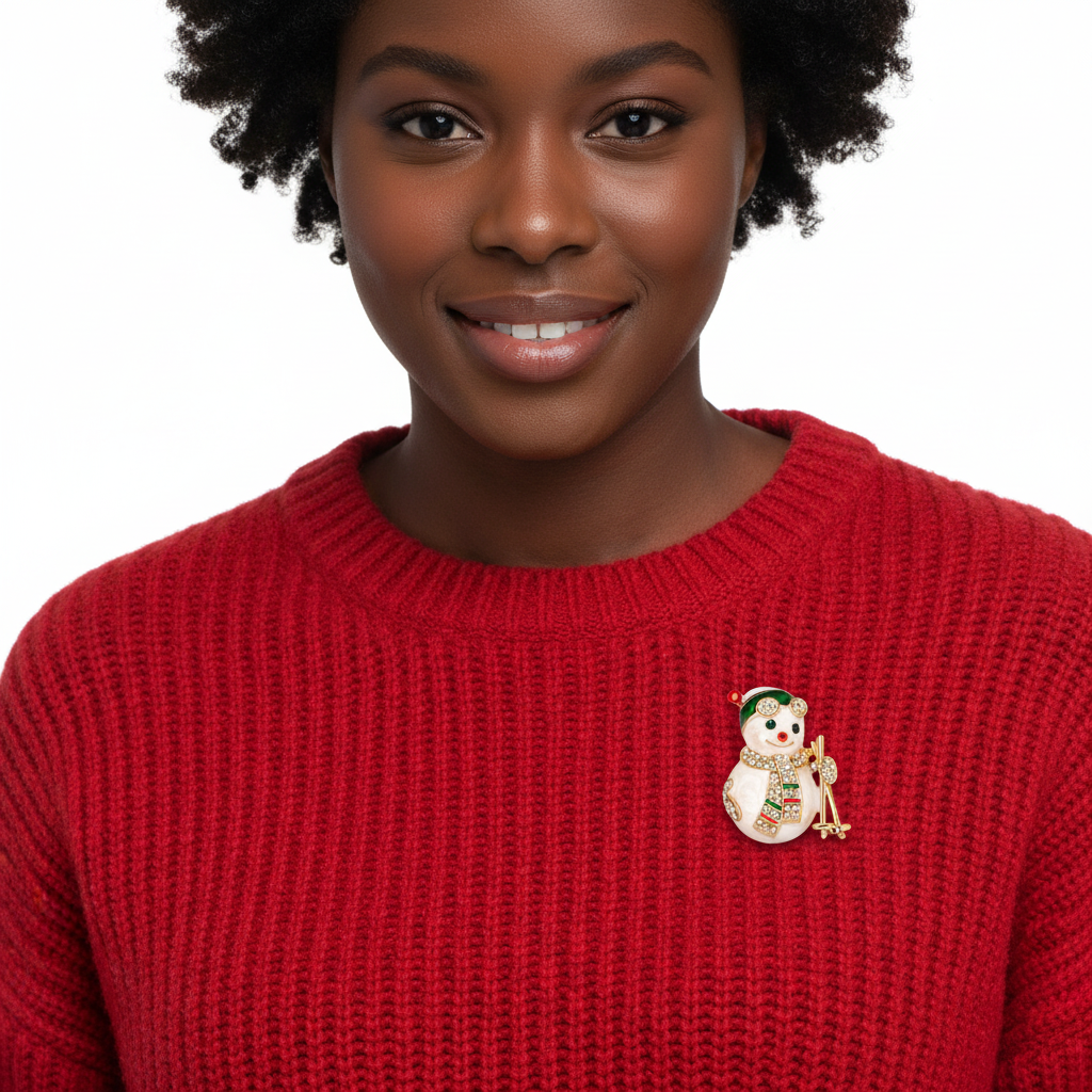 Black woman wearing sparkling rhinestone snowman skiing brooch on red sweater - front view