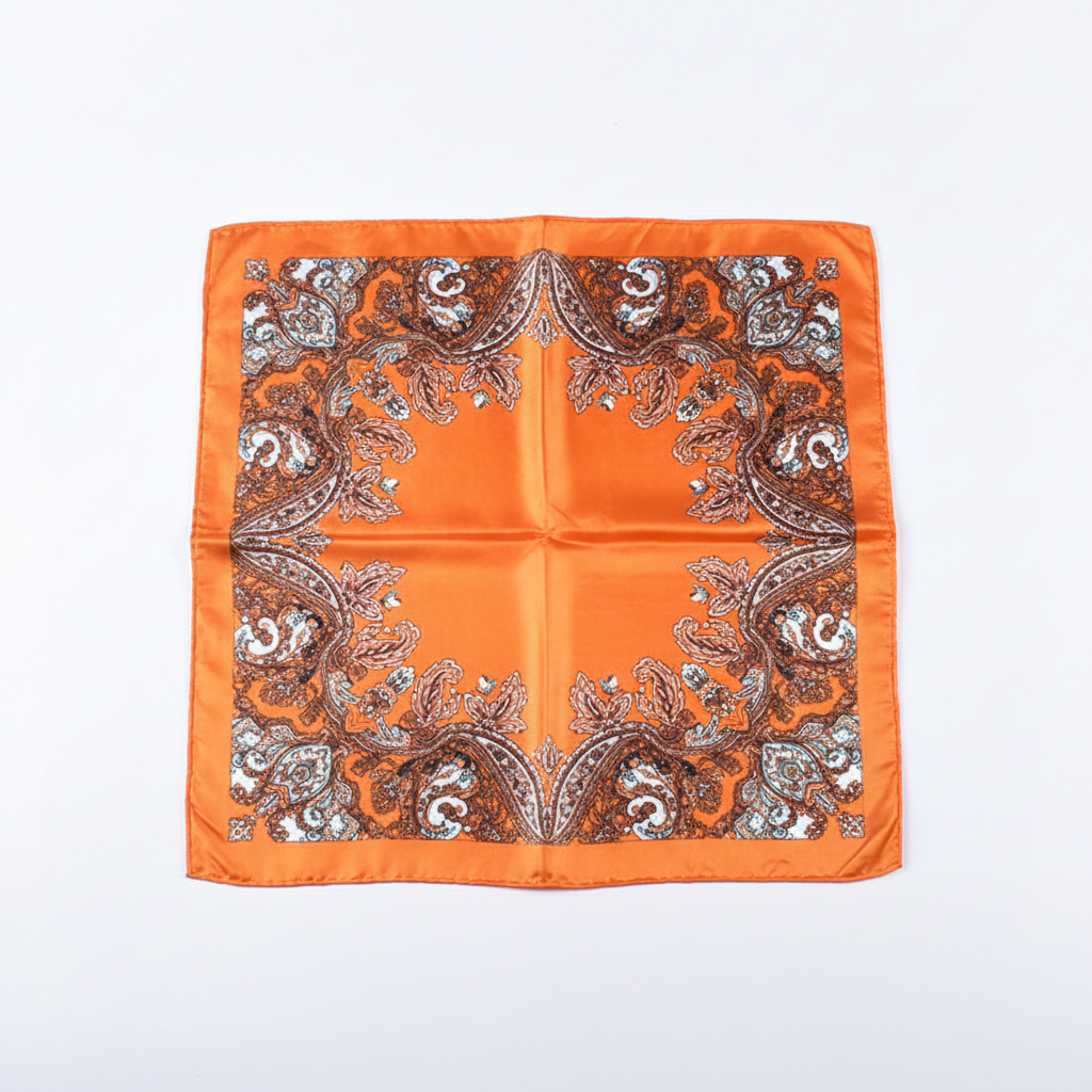 Orange paisley floral silk-feel square scarf flat lay showing symmetrical border print
