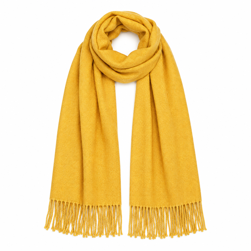 Product shot of the mustard yellow tassel scarf