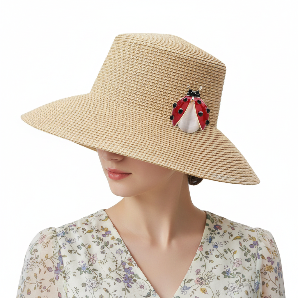 Red ladybug brooch on straw hat