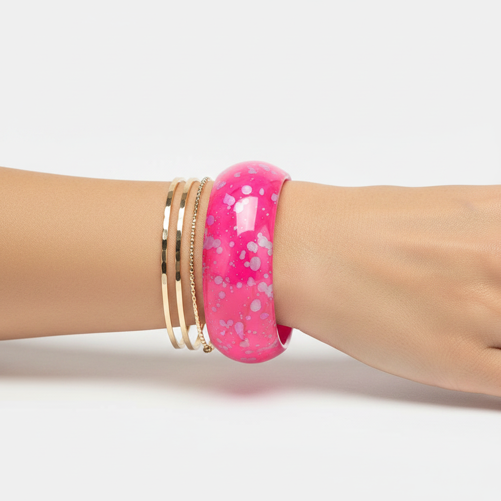 Stacked styling - pink bangle with gold bangles